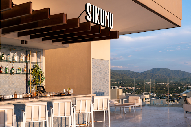 Sikunu Rooftop Bar with View of Mountains in Background