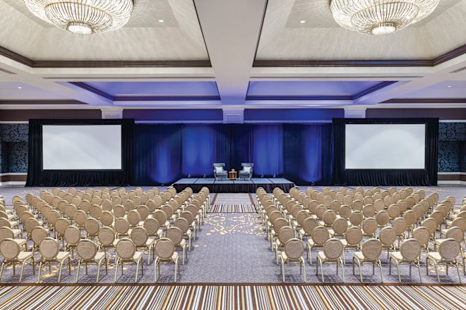 large ballroom with rows of chairs