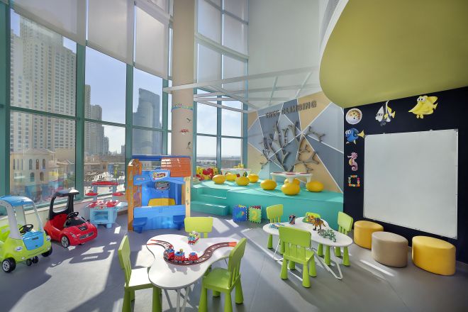 View of Kids Club with Toys and Small Tables and Chairs