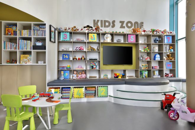 View of Kids Zone with Toys Books and Television