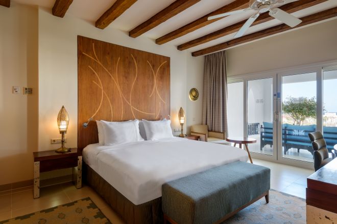 Large Bed in a Suite with Balcony