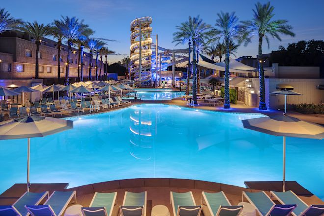 Paradise Pool with Palm Trees and Lounge Chairs under Umbrellas