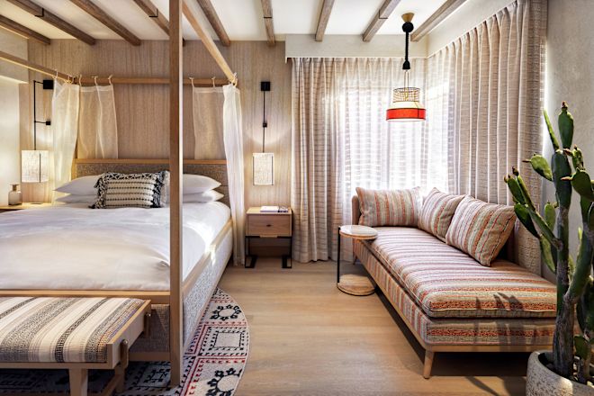 Cottage Bedroom View of Bed and Side Couch