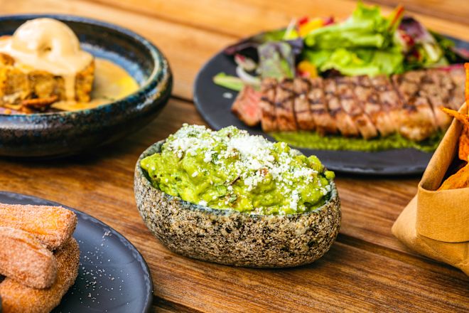 Plates of food on wooden table