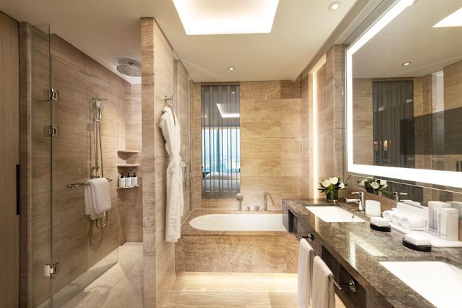 Executive Bathroom with Dual Vanity, Tub, and Shower