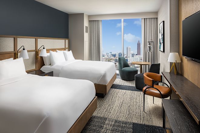 Two Beds in a Guest Room with HDTV and City View