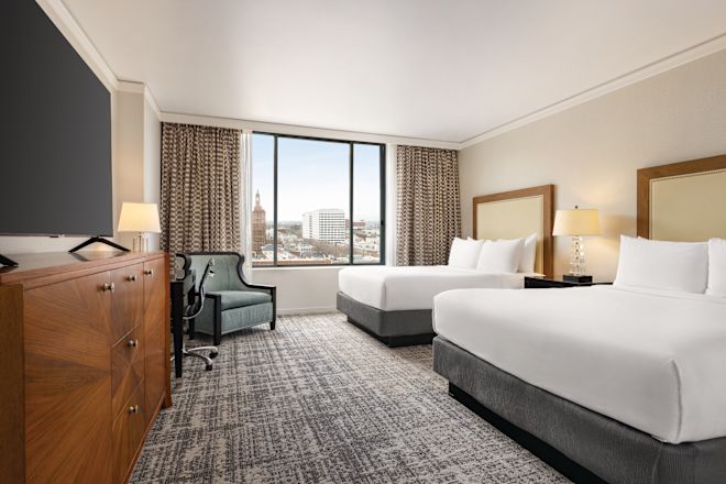 Guest Room with Two Queen Beds, chair and tv