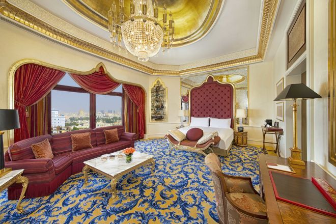 bedroom with bed, sofa and desk
