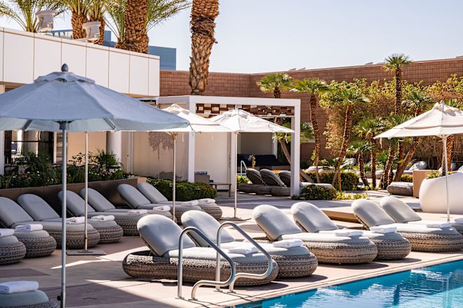 Outdoor Pool with Lounge Chairs under Umbrellas