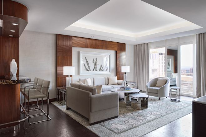 Guestroom lounge area with tables and couches