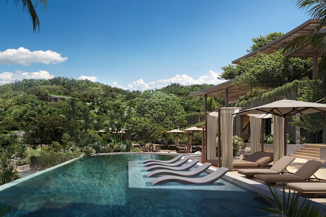 Outdoor Pool Area with Lounge Chairs under Umbrellas