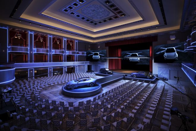 Grand Ballroom Setup with a Stage for an Event with Cars