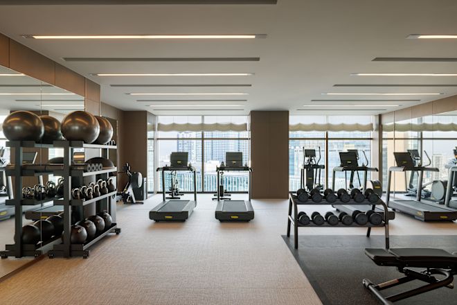Fitness center with cardio machines and free weights
