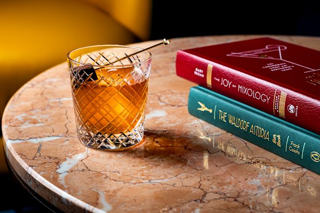 Books and a Drinks on a Table at Canes & Tails