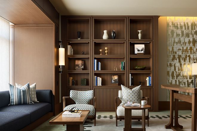 Library area with comfortable seating area and shelves