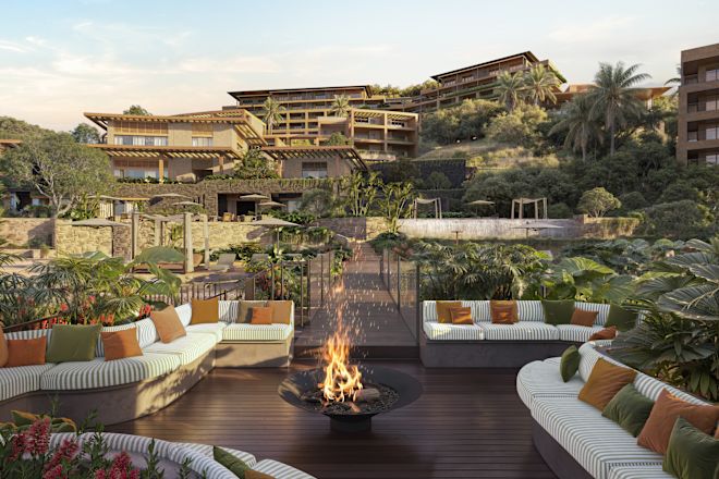 Outdoor seating area with fire pit and surrounding buildings