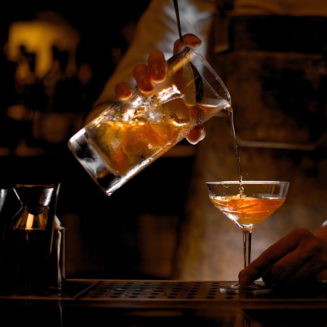 Bartender pouring a cocktail