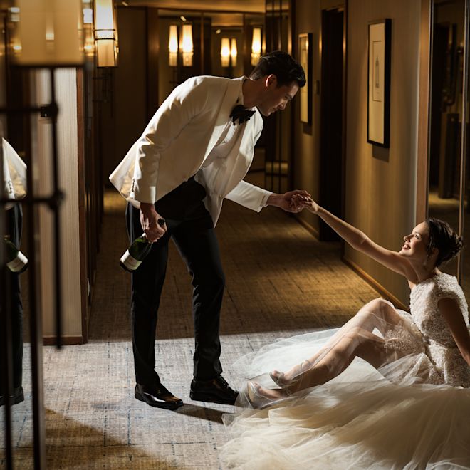 Couple Holding Hands on Their Wedding Day