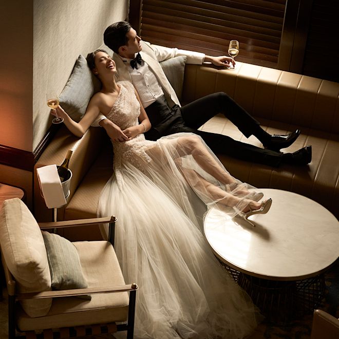 Couple Drinking and Relaxing on Their Wedding Day