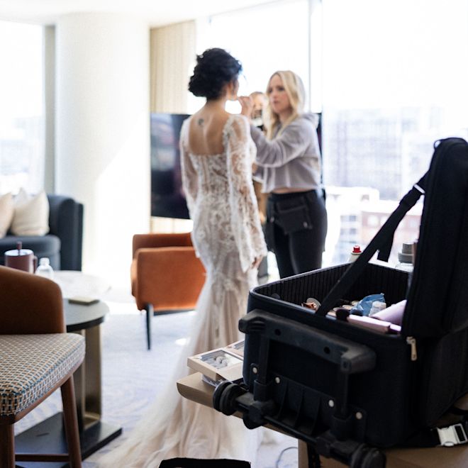 Girls in a Suite Getting a Bride Ready for Her Wedding