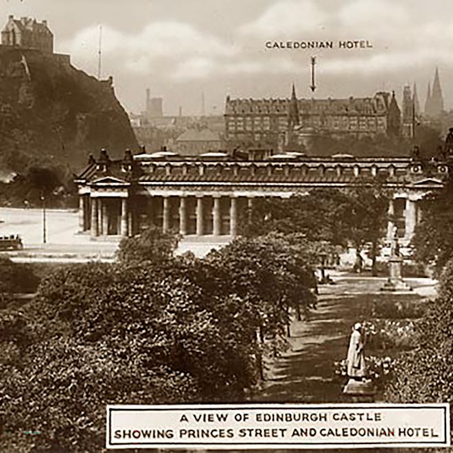 Old shot of arrow pointing to Caledonian hotel with Edinburgh surrounding