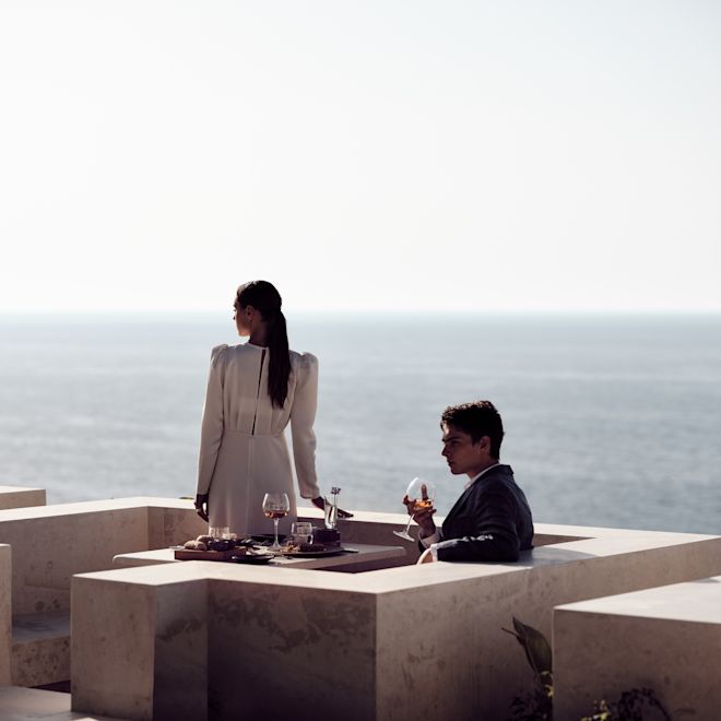 Couple Dining at Cretamos Restaurant with View of the Water