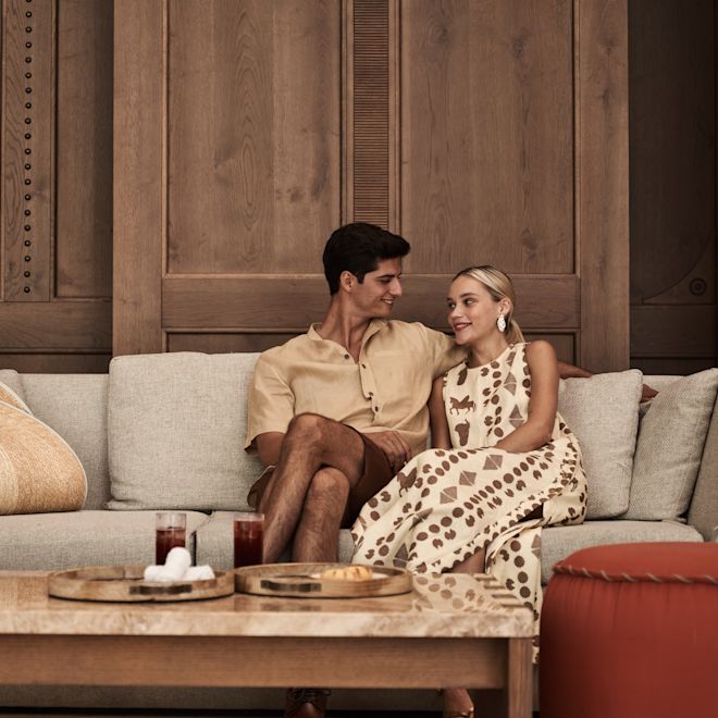 Couple Sitting in Lobby Area