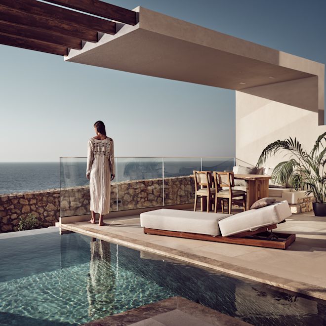 Woman Standing by Outdoor Private Pool Area of a Guest Room