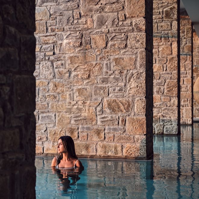 Woman in an Indoor Thalassotherapy Pool at the Spa