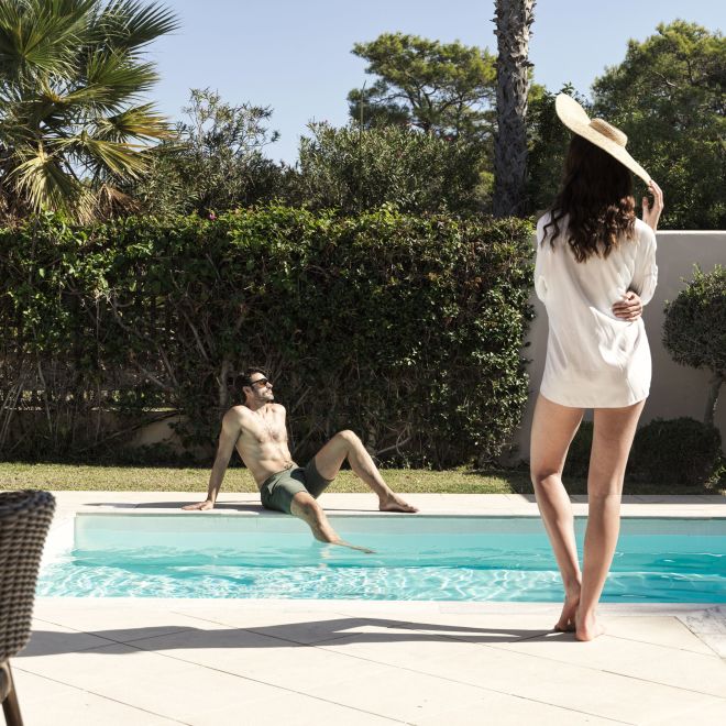 Man and Woman at the Pool, Enjoying a Sunny Day
