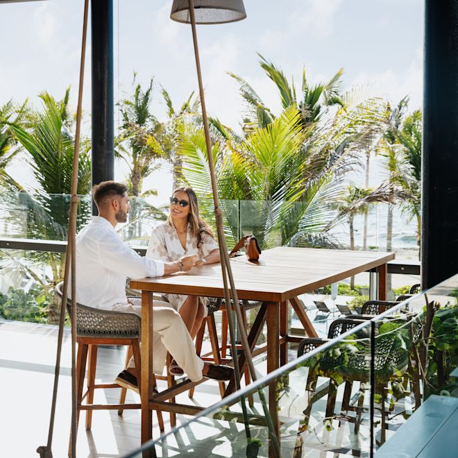 Couple talking at outside dining area