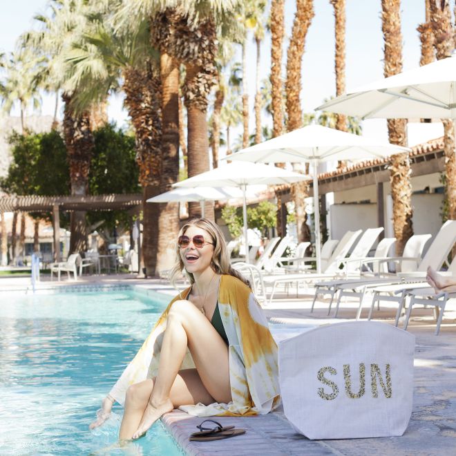 Woman laughing by pool