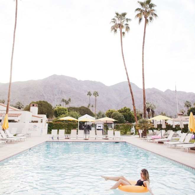 Woman relaxing in front of pool