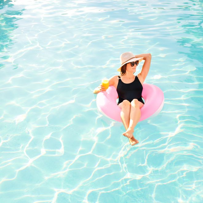 Woman relaxing on rubber ring
