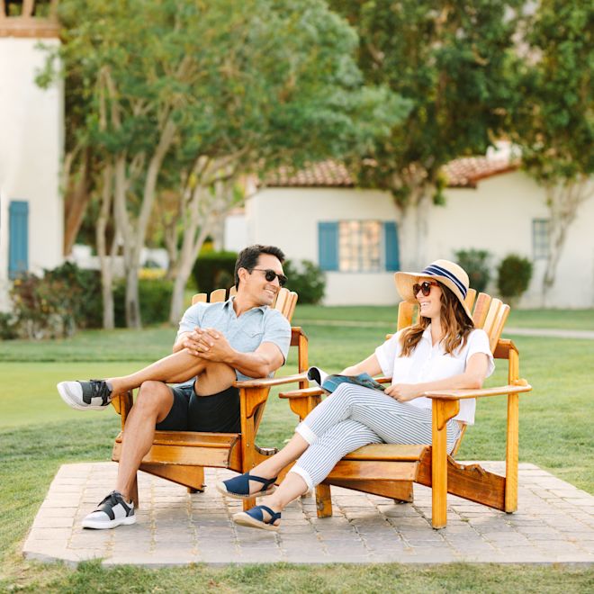 Man and woman relaxing on chairs