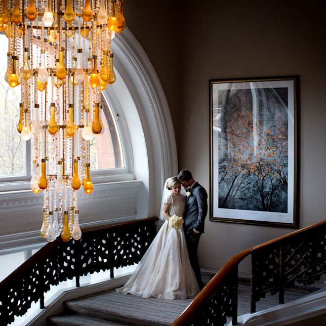 wedding couple posed on stairs