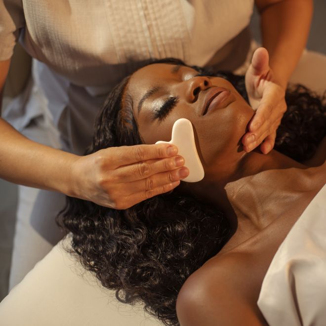Woman receiving spa facial treament