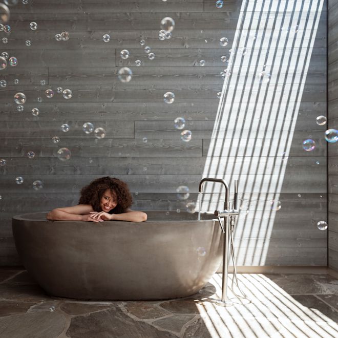 View of woman in spa bathtub