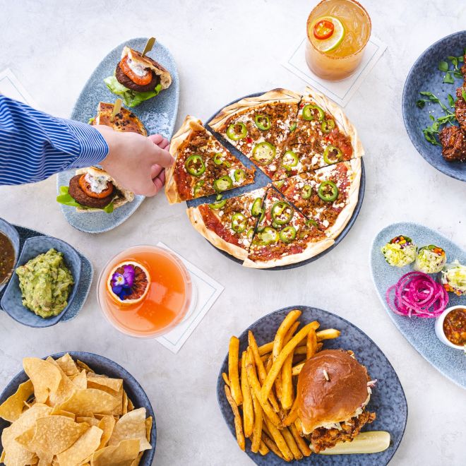 Overhead view of food options, with hands picking up food