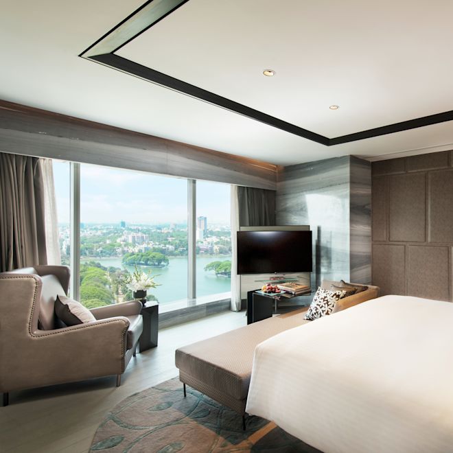 One Bed Guest Bedroom with Armchair and HDTV
