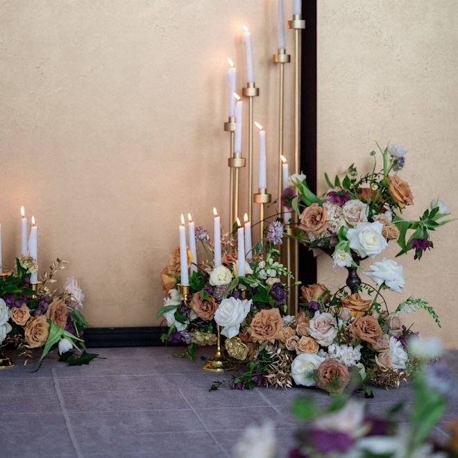 Flowers and Lit Candles in a Ballroom
