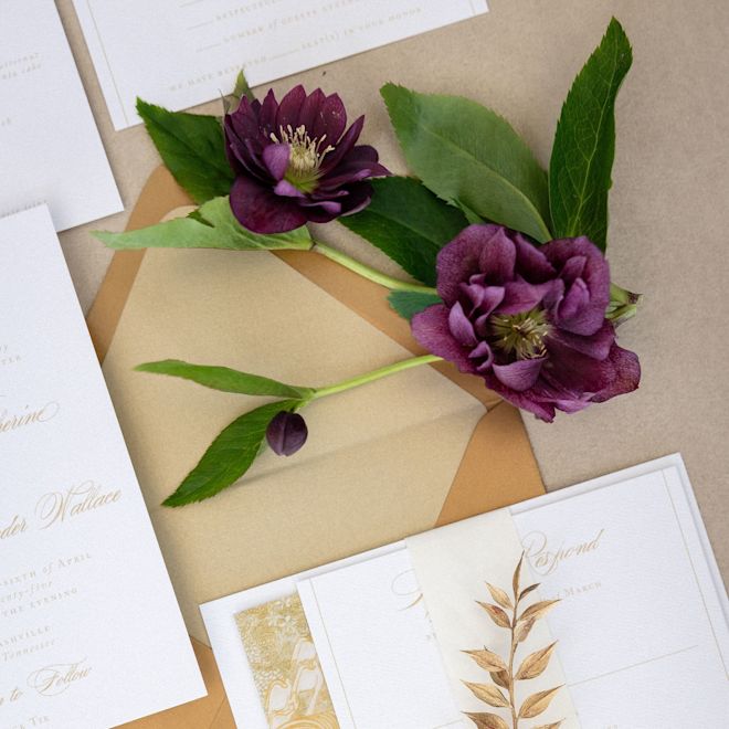 Detail of Wedding Invitation Cards and Flowers on a Table