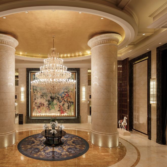Lobby area with columns and chandelier