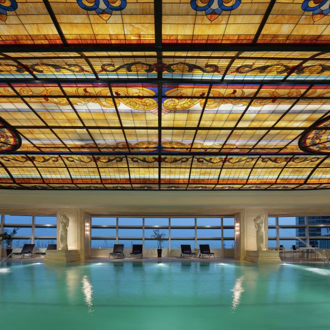 Indoor pool with ornate ceiling
