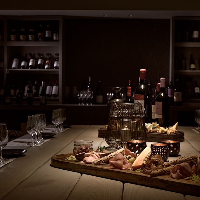 Food and Wine on a Table at Cretamos Wine Cellar