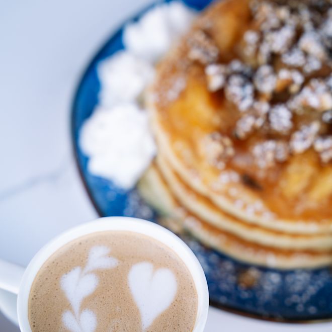 Carnegie Diner & Cafe, pancakes plate and cappuccino with hearts design in the foam
