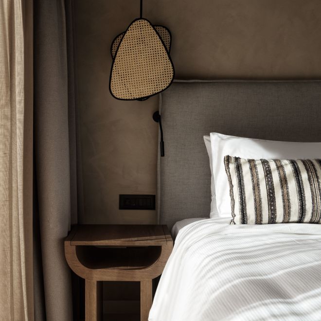 Large Bed and Nightstand in a Room