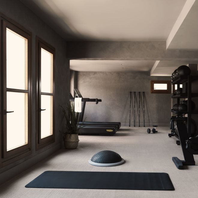Fitness center with cardio machines and mat