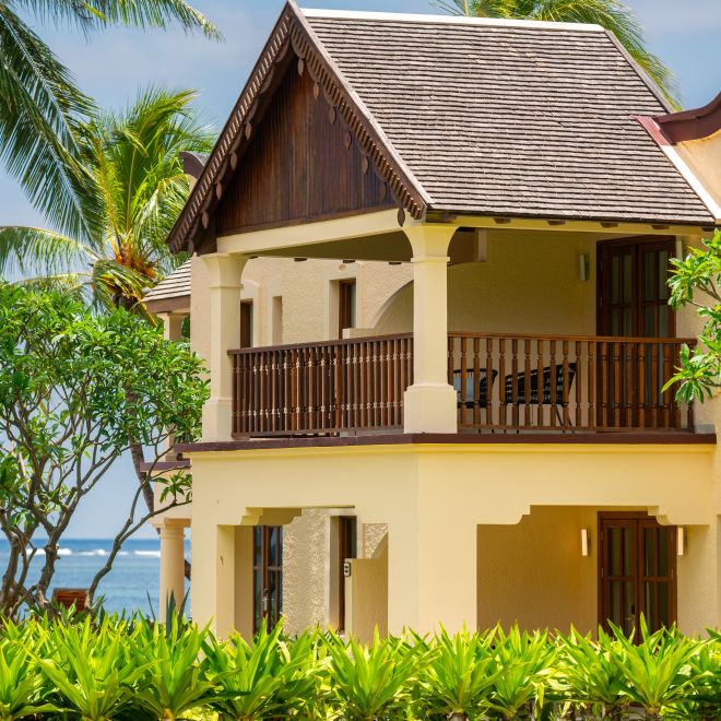 Hotel exterior with trees and balcony