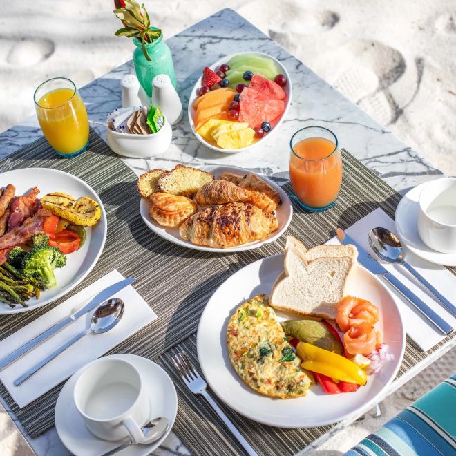 Top down view of breakfast meal on beach